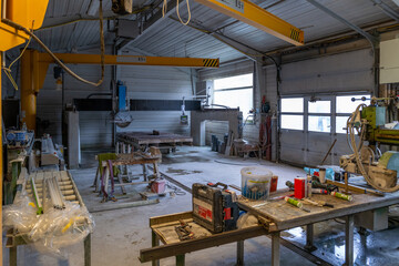 inside the stonemason store there are many tools for working with stones and granite - obrazy, fototapety, plakaty