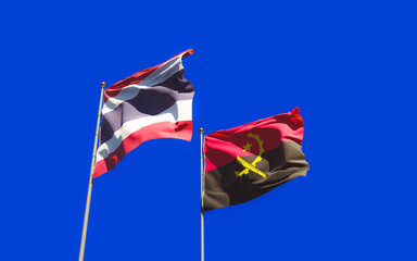 Flags of Thailand and Angola.