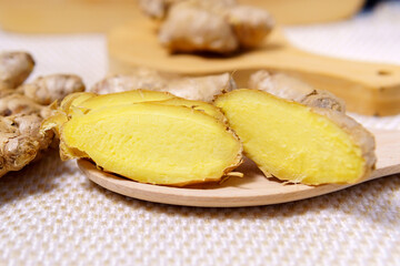 Fresh whole and chopped ginger root. Close-up, selective focus