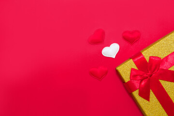 Happy Valentine's Day flatlay. Top view present gift box, hearts on on yellow color of the red background. panton