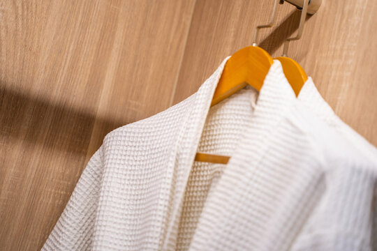white bathrope hang in wardrobe