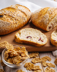 Closeup on sliced muesli cereal bread on the wooden cutting board