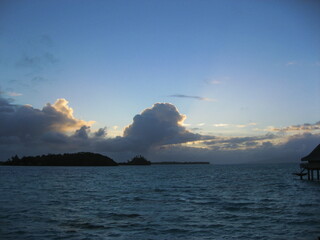 Beautiful sunrise from the Pacific  Ocean through the white clouds