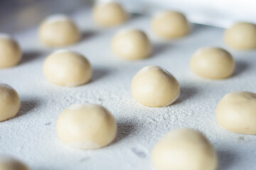 close up of doughnut dough balls