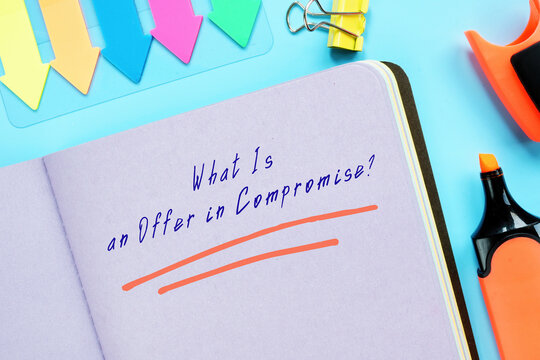 Legal Concept Meaning What Is An Offer In Compromise? With Sign On The Page.