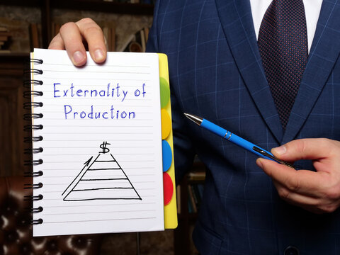 Business concept about Externality of Production with sign on the white notepad.