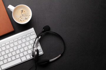 Office desk with headset and supplies