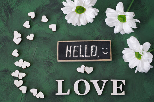 hello love with white flowers and hearts on green background - Powered by Adobe