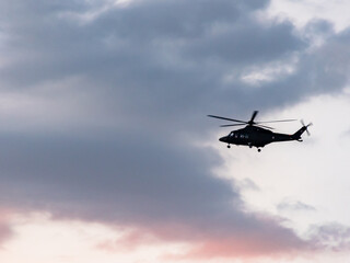 Fototapeta na wymiar helicopter flying in the sky