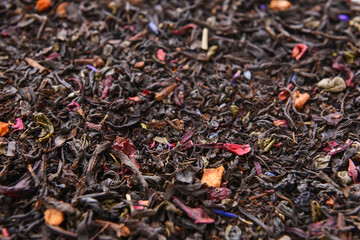 Dry tea leaves as background