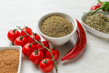 Composition with different spices and herbs on light background