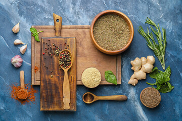 Composition with different spices and herbs on color background