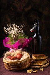 Easter still life. Eggs in a wicker basket. Christian holiday and food.