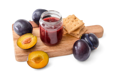 Glass jar with delicious homemade plum jam on white background
