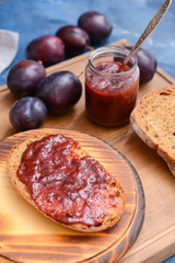 Composition with delicious homemade plum jam on board