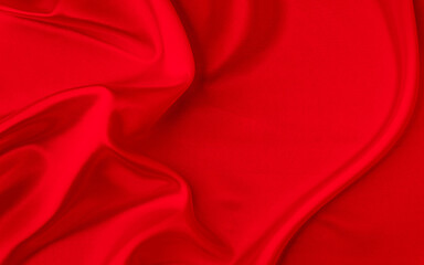 Black red satin dark fabric texture luxurious shiny that is abstract silk cloth background with patterns soft waves blur beautiful.