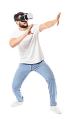Young man with virtual reality glasses on white background