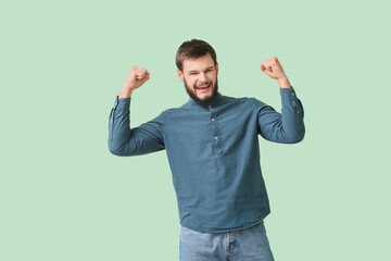 Portrait of happy man on color background