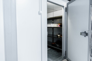 Refrigerator room door in professional kitchen in restaurant