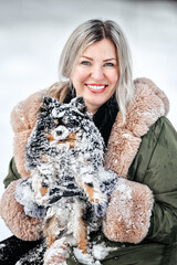 Beautiful woman play with a dog,