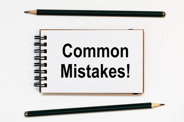 WHITE SPIRAL NOTEBOOK, TWO PENCILS WITH Common Mistakes