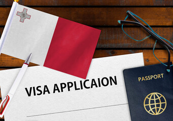 Flag of Malta, visa application form and passport on table
