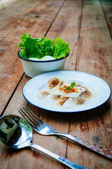 Selective focus of Thai steamed rice-skin dumplings or khao kriap pak maw is tow popular and unique Thai street food snacks ,
thai style dessert on wooden