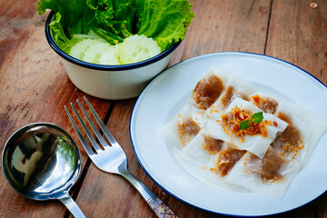 Selective focus of Thai steamed rice-skin dumplings or khao kriap pak maw is tow popular and unique Thai street food snacks ,
thai style dessert on wooden