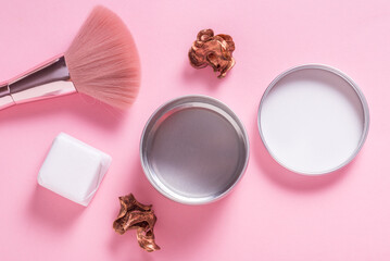 Tin metal cosmetic box, case on pink background