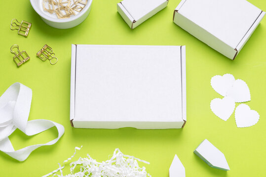 White Cardboard box on color office desk