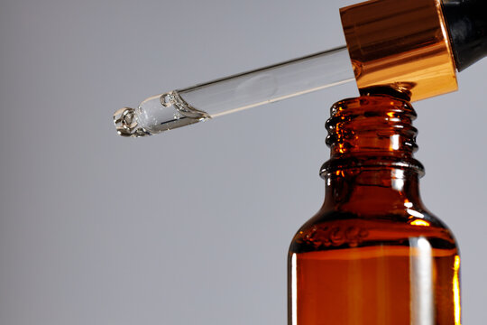 Skincare Serum In Glass Dropper Bottle Close Up