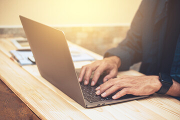 People using laptop computer , Hand typing on keyboard , laptop technology working from home