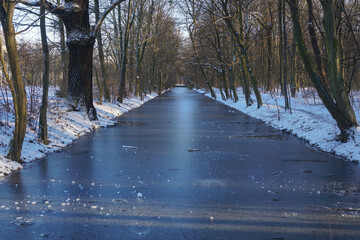 A frozen canal in the park 