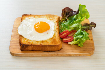 bread toasted with cheese and fried egg