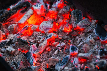 Bright red burning coals, background photo
