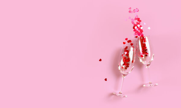 Two Clinking Champagne Glasses With Splash Of Red Heart Shaped Confetti Over Pink Background. Overhead View, Copy Space. 3D Rendering Illustration.