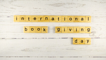 International Book Giving Day.words from wooden cubes with letters