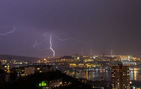 Lightning storm over night city.