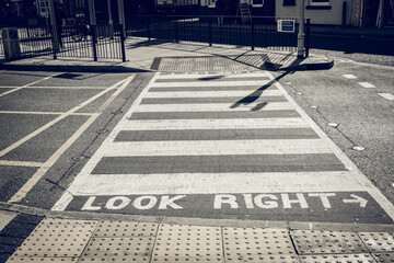 Look right sign on the zebra crossing on the road..