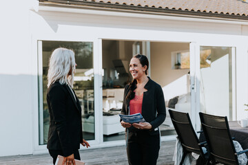 Estate agent showing woman house