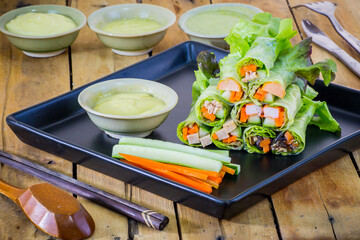 Fresh vegetable salad roll with salad dressing