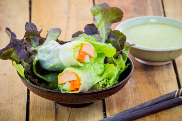 Fresh vegetable salad roll with salad dressing