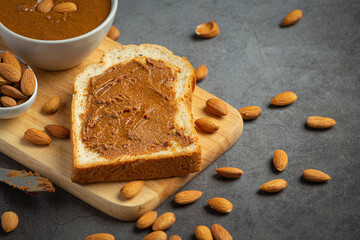 Raw Organic Almond Butter on dark background