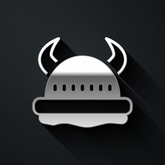 Silver Viking in horned helmet icon isolated on black background. Long shadow style. Vector.