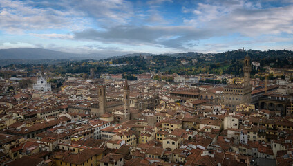 Fototapeta na wymiar Panoramic view of Florence, Italy. Santa Croce Church, Palazzo Vecchio and other sightseeing. Panorama of the city from above.