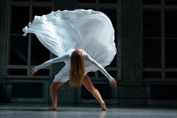 a girl throws a white dress up into the air, beautiful bye, contemporary, ballet, general plan.