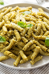 Homemade Pesto Twist Pasta on a plate, low angle view. Close-up.