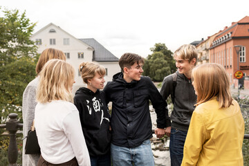 Smiling teenagers talking
