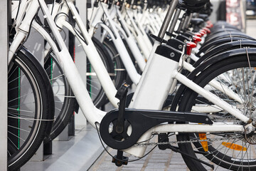 Urban electric bikes charging batteries in the city. Transportation