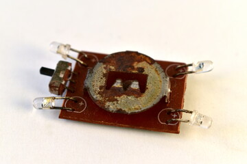 rusty board with LEDs and toggle switch